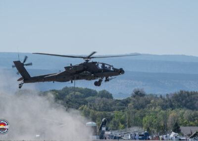 Apache Helicopter kicking up dust as it departs MTJ